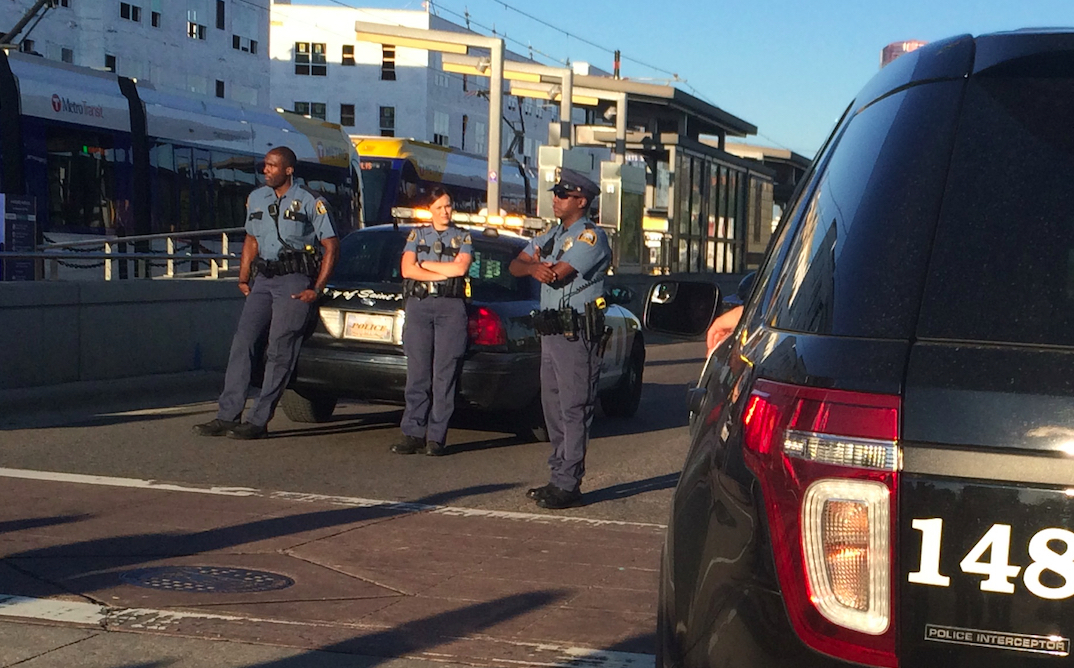 Police escort along University Ave.