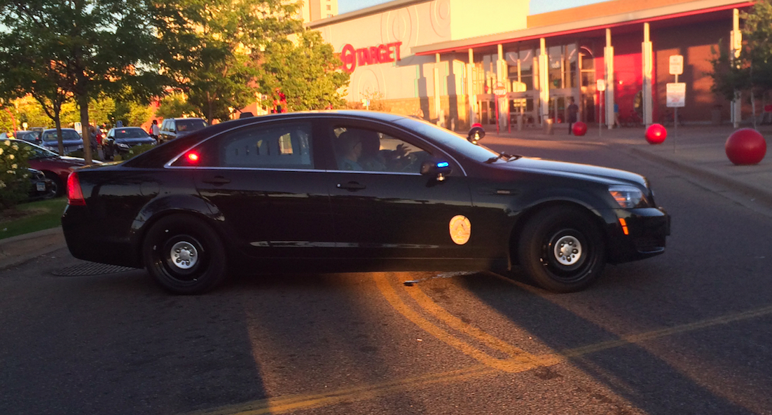 Unmarked police car in front of Target, next to SPPD station.